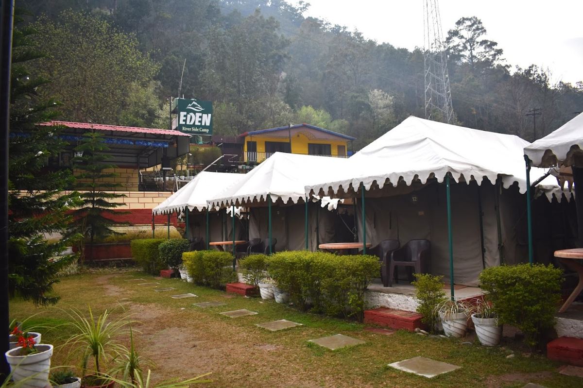 Daytime view of Eden camp tents and hillside